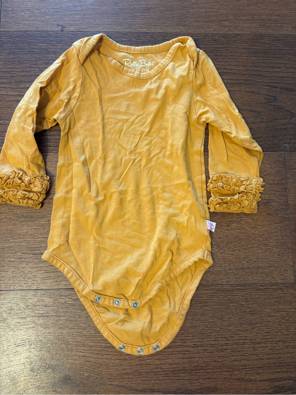 Ruffle Butts Mustard Long Sleeve Ruffle Cuff One-Piece